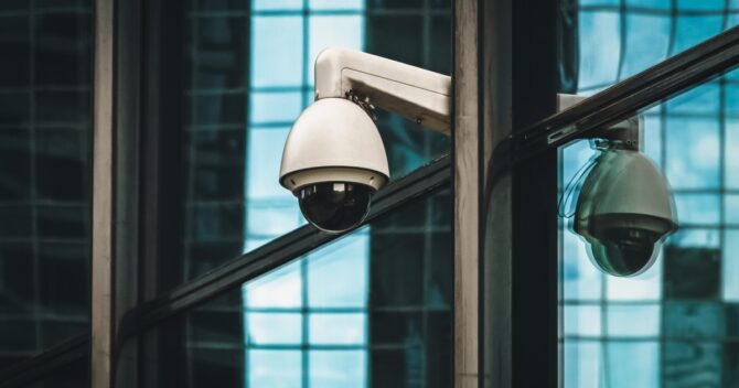 surveillance 360 degree camera on modern building facade NYC