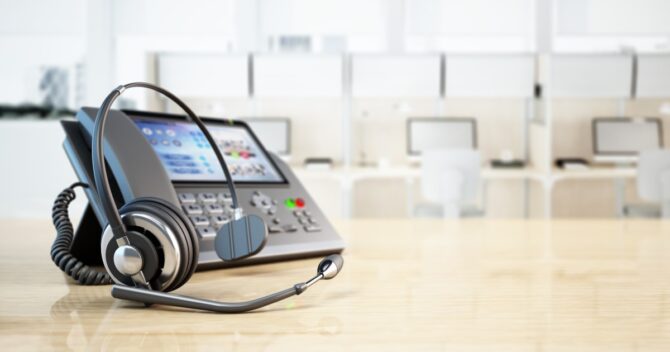 Modern VoIP phone and headset business communications img